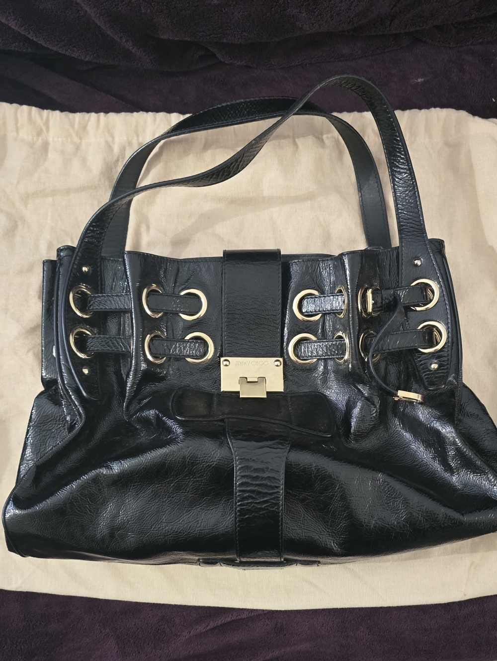 Jimmy Choo Black Leather Shoulder Bag with Gold Hardware and Grommets